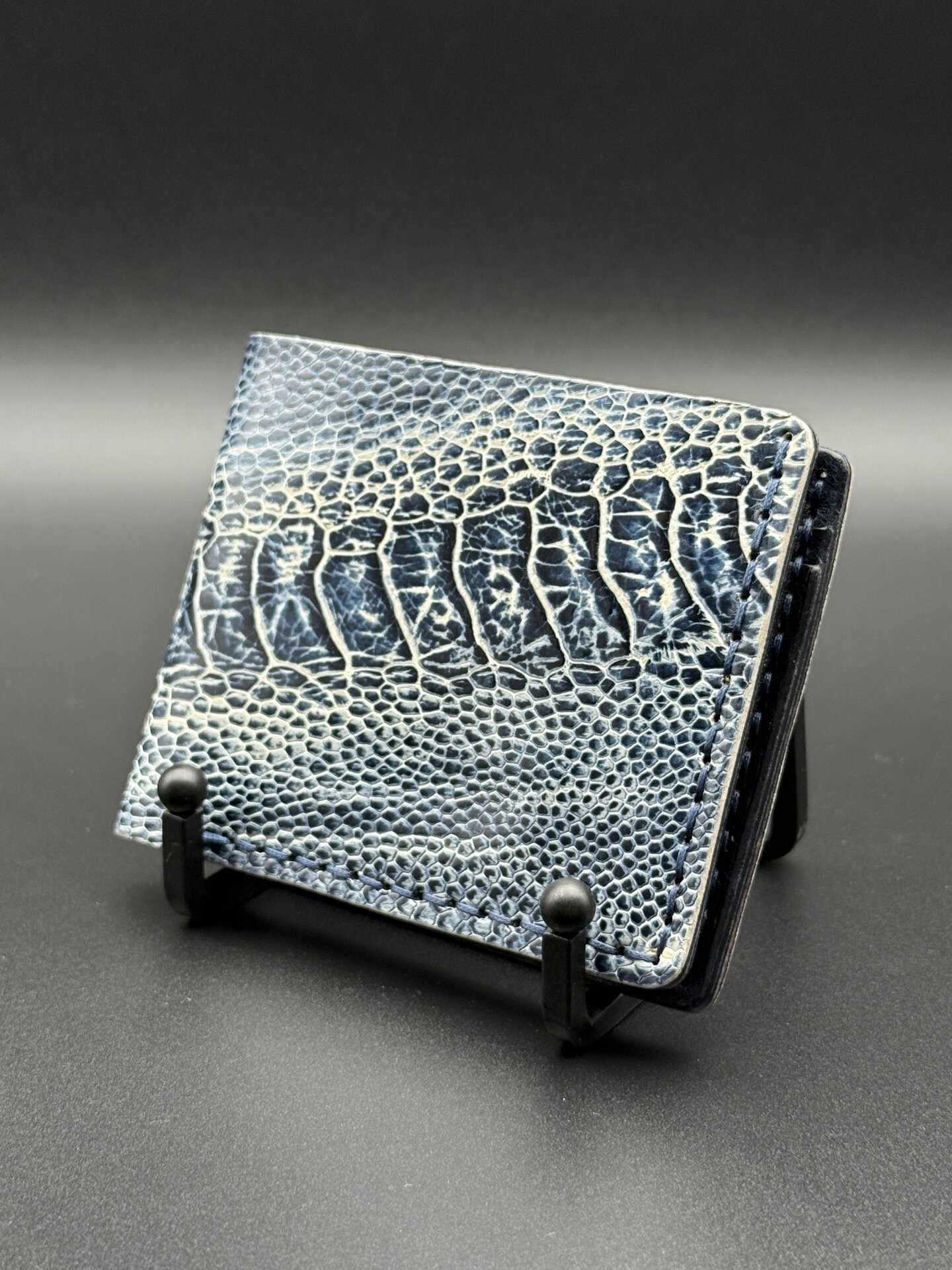 Navy and white ostrich leg bifold wallet with matching ostrich leg keychain