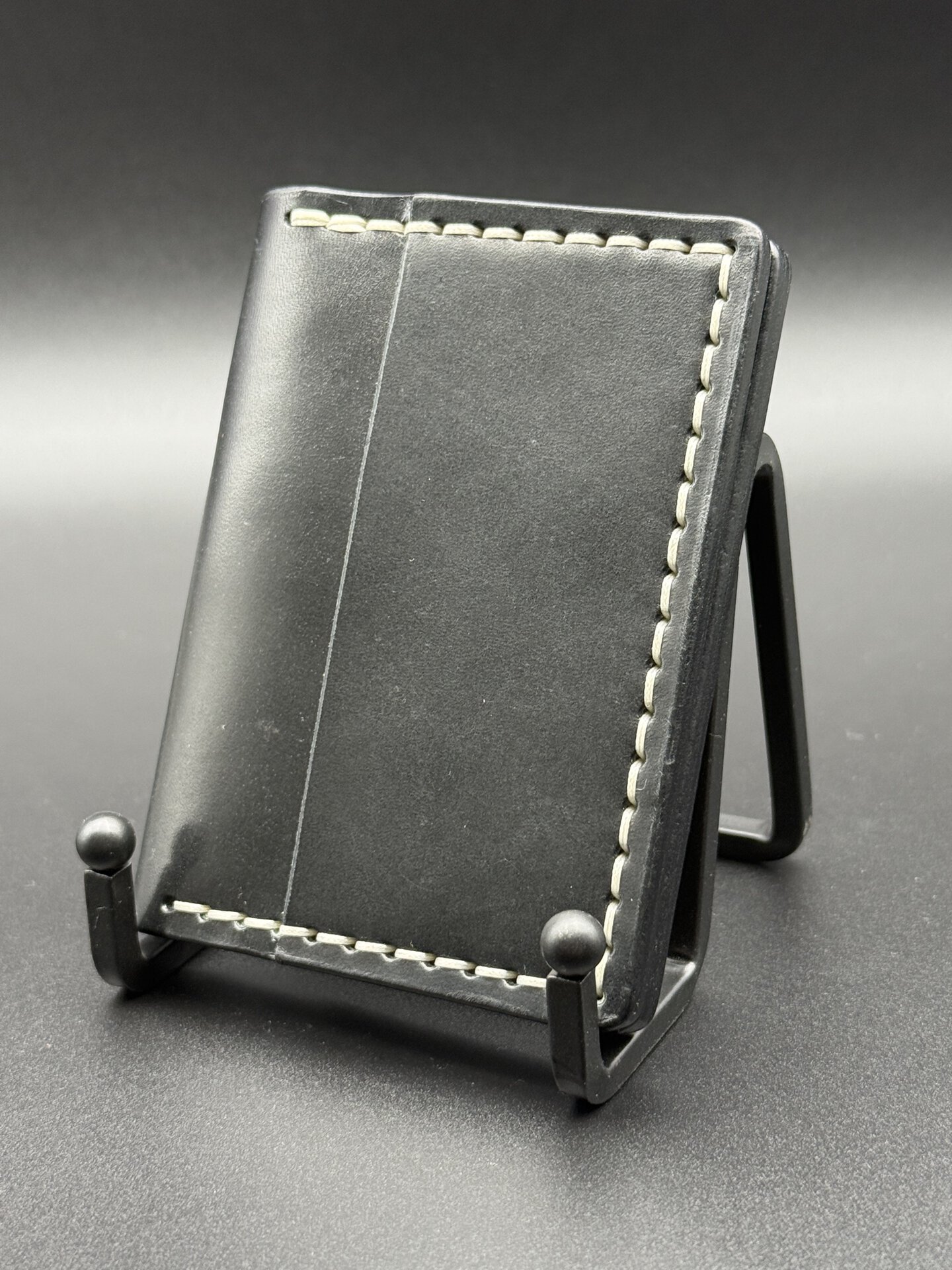 Black Wickett & Craig traditional harness leather Brasco minimalist wallet with cream stitching